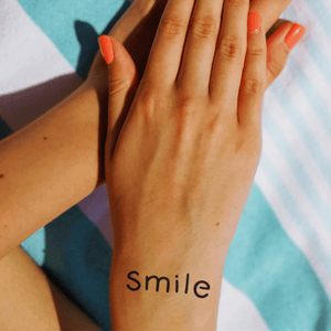 "Smile" word tattoo 1 - Temporalis