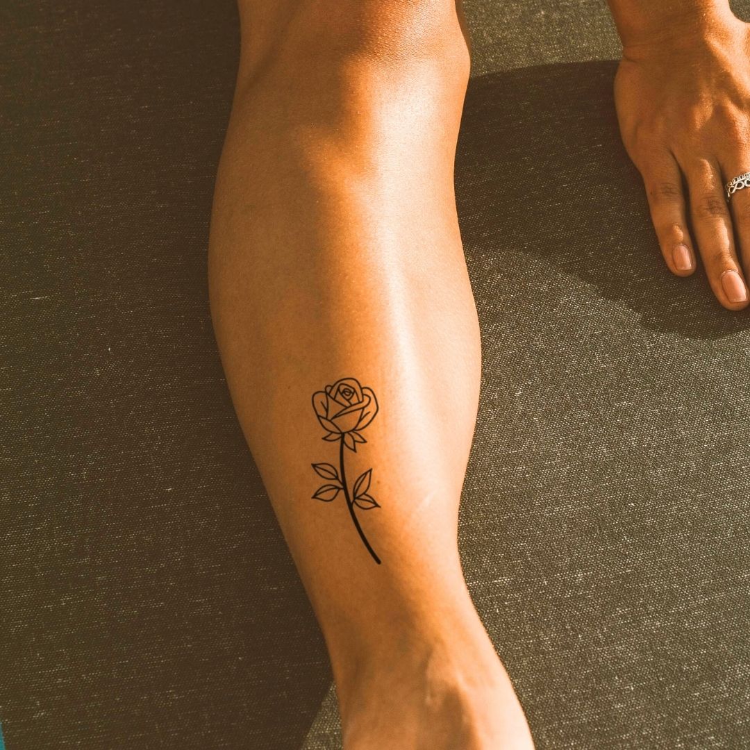 Fine line rose temporary tattoo with stem and leaves - 1 | Temporalis